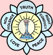 A lamp inside a five-petalled lotus whose petals read Truth, Right Conduct, Peace, Love and Non-Violence